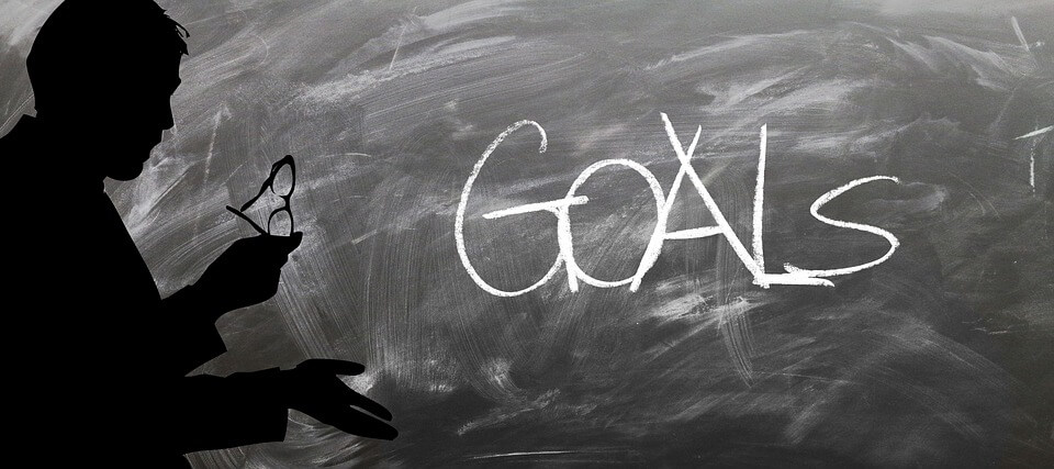 Chalkboard with the word "goals" on it